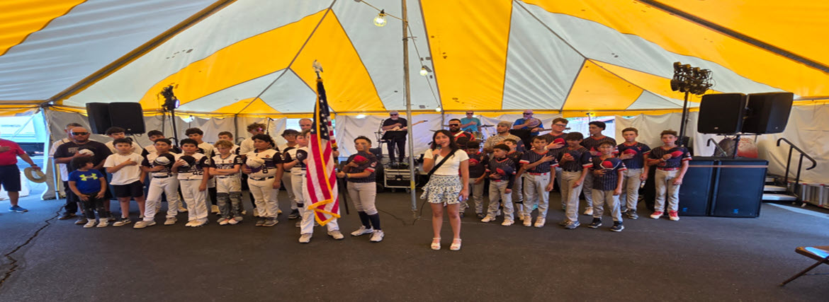 Singing the National Anthem in the Entertainment Tent