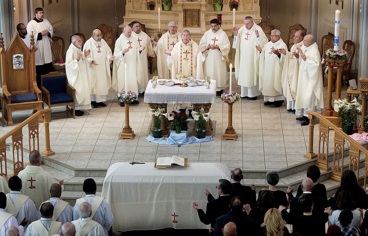 Bishop Stephen Berg, center, surrounded by other bishops and clergy memebrs, says the funeral mass for Bishop Arthur Tafoya on April 10, 2018 at Sacred Heart Cathederal in Pueblo, CO. (Photo Courtesy of Chris McLean, The Pueblo Chieftain)"